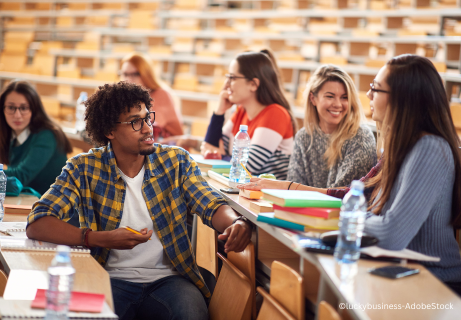 Young freshmen students talking and smiling